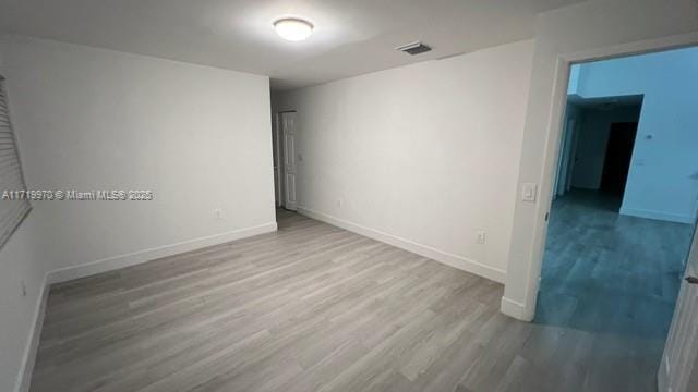 unfurnished room featuring wood-type flooring