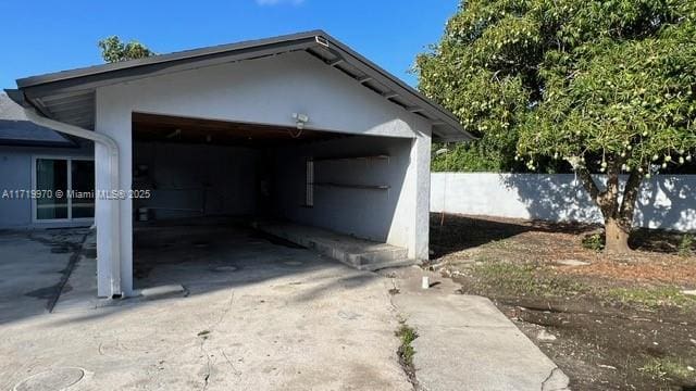 view of side of property with a garage