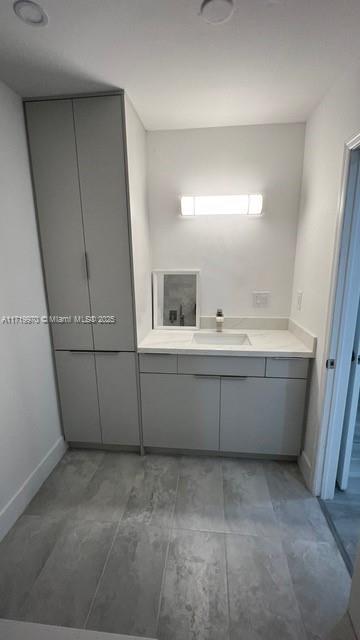 kitchen featuring white appliances, sink, and light hardwood / wood-style flooring