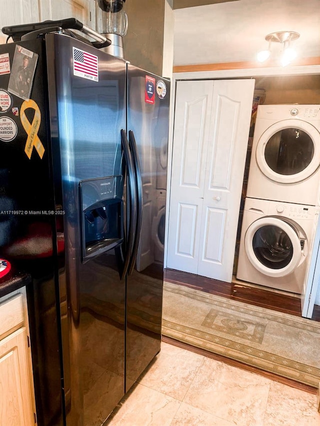 washroom with stacked washer and dryer