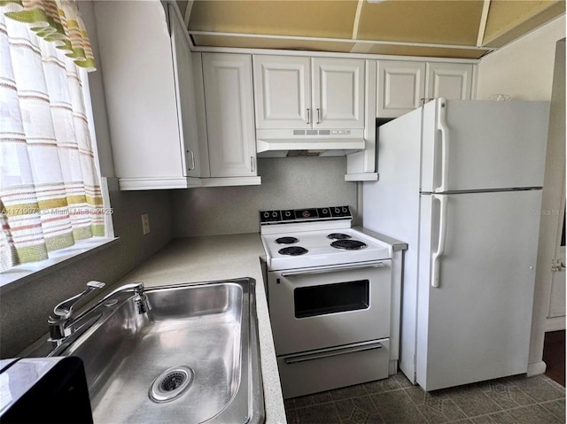 kitchen featuring white cabinets, white appliances, and sink