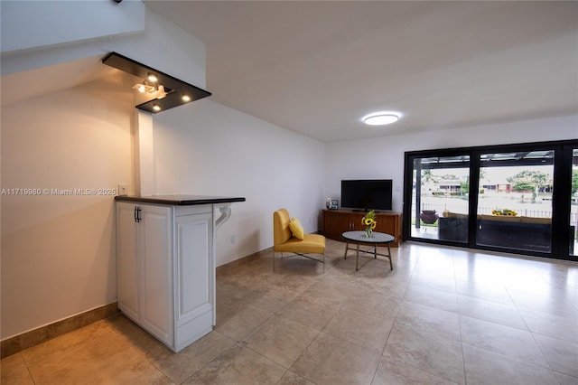 sitting room with light tile patterned floors