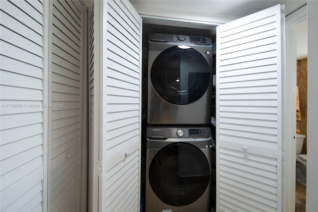 clothes washing area with stacked washer / drying machine