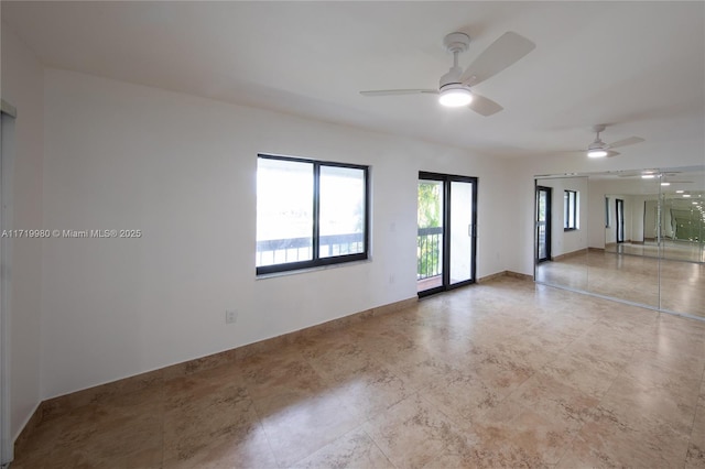 spare room with ceiling fan