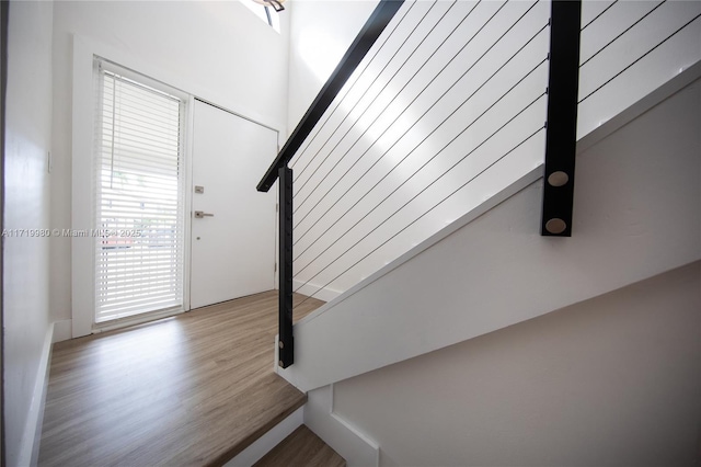 staircase featuring hardwood / wood-style floors