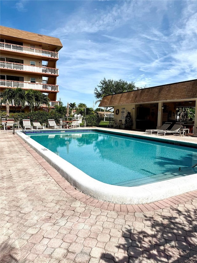 view of swimming pool featuring a patio