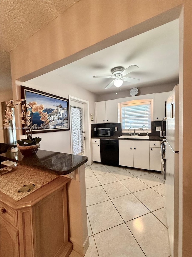 kitchen with ceiling fan, sink, black appliances, white cabinets, and light tile patterned flooring