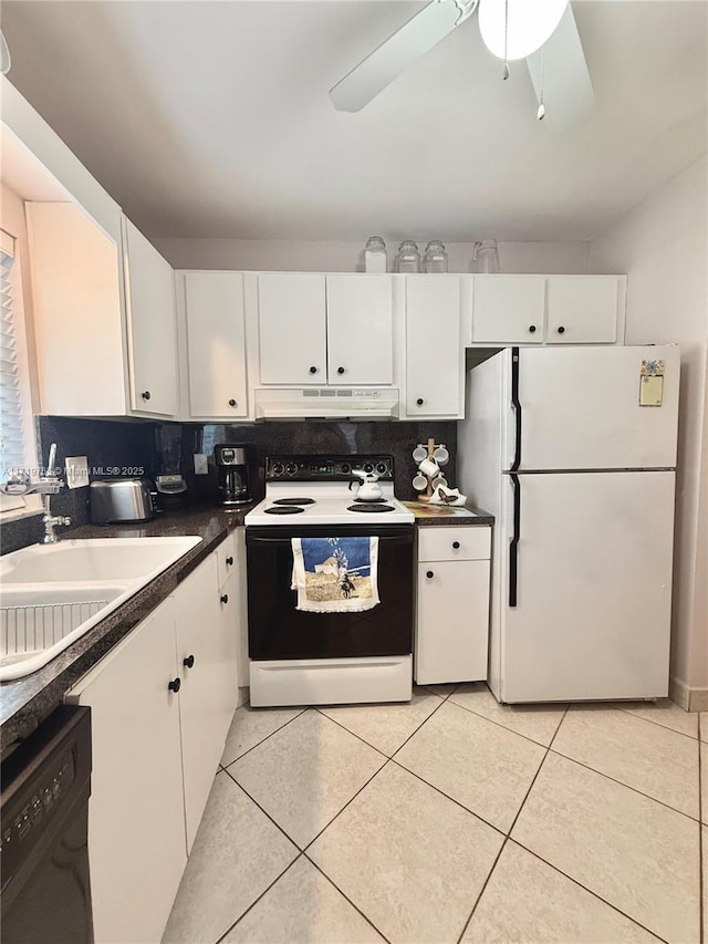 kitchen with white cabinets, white appliances, and light tile patterned flooring