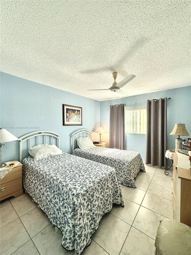 bedroom featuring a textured ceiling and ceiling fan