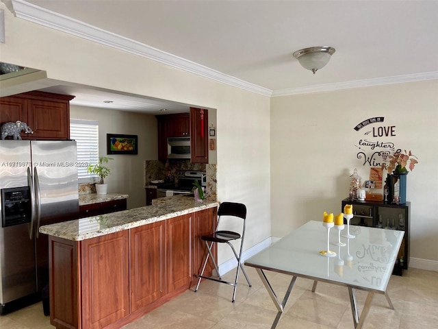 kitchen with light stone countertops, kitchen peninsula, stainless steel appliances, and ornamental molding