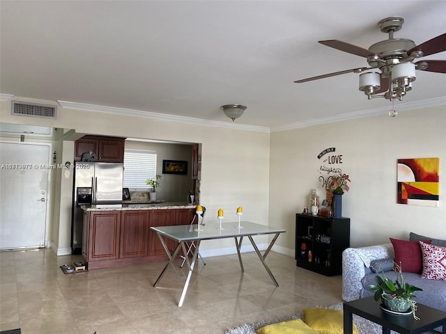 kitchen with stainless steel refrigerator with ice dispenser, ceiling fan, and crown molding