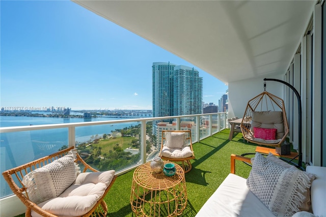 balcony featuring a water view