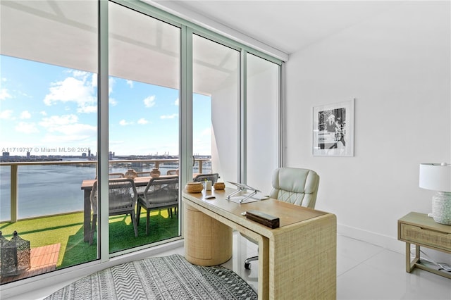 tiled home office with a wall of windows