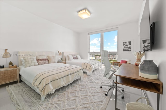 bedroom featuring a wall of windows