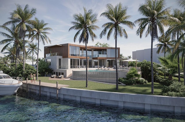 back of property with a balcony, a pool, a lawn, and a water view