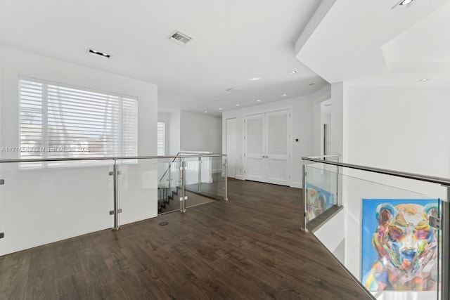 hallway with dark wood-type flooring