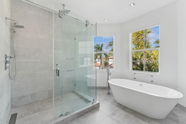 bathroom featuring separate shower and tub