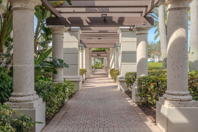 property entrance featuring a pergola