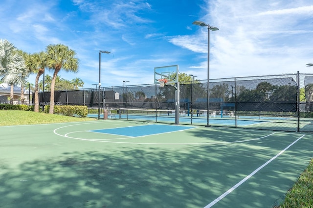 view of basketball court with tennis court