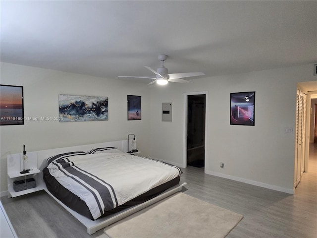 bedroom with ceiling fan and light hardwood / wood-style flooring