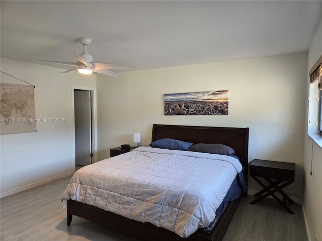 bedroom with wood-type flooring and ceiling fan