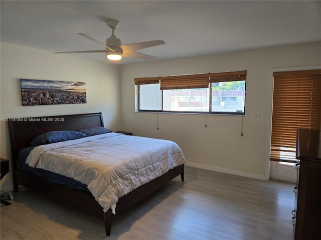 bedroom featuring ceiling fan and hardwood / wood-style flooring