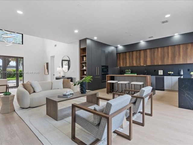 living room with light hardwood / wood-style flooring