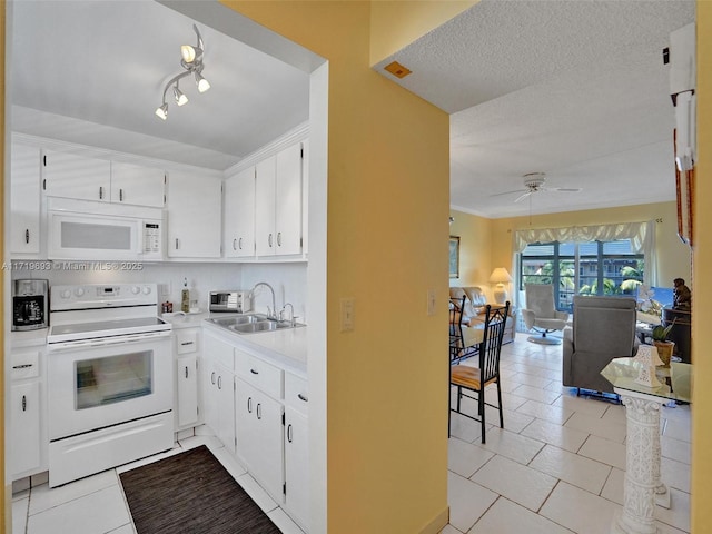 kitchen featuring white cabinets, ceiling fan, white appliances, and light tile patterned floors