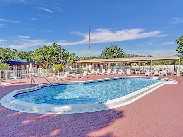 view of swimming pool with a patio area