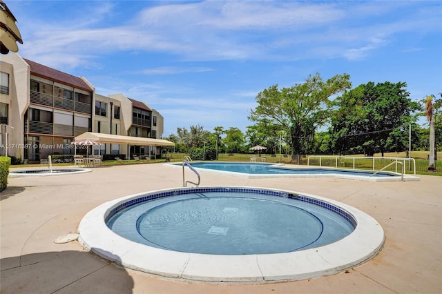 view of swimming pool with a patio area