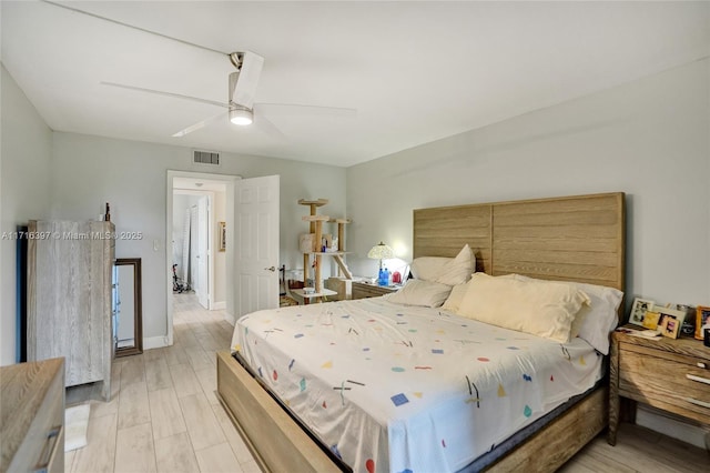 bedroom featuring light hardwood / wood-style flooring and ceiling fan