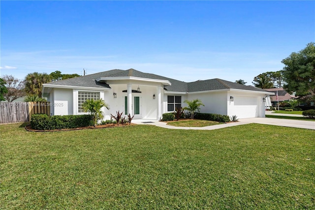 view of front of house featuring a front yard and a garage