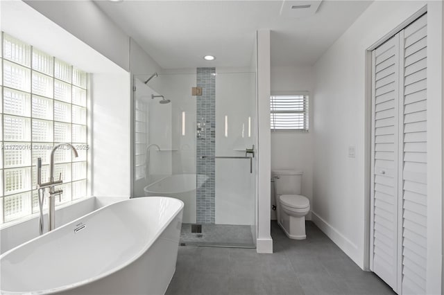 full bathroom featuring toilet, independent shower and bath, and sink