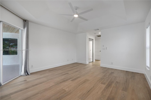 unfurnished room featuring ceiling fan, plenty of natural light, and light hardwood / wood-style floors