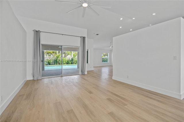 empty room with light wood-type flooring and ceiling fan