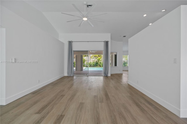 unfurnished living room with ceiling fan, light hardwood / wood-style flooring, and vaulted ceiling