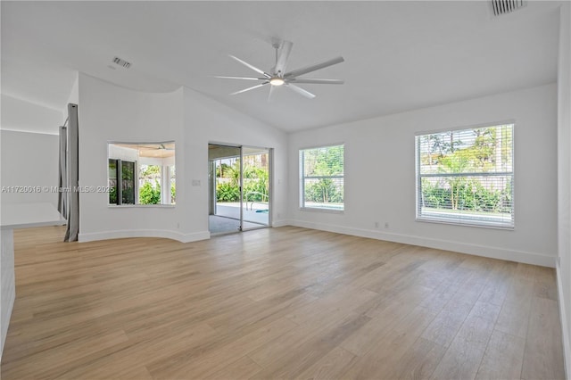 empty room featuring ceiling fan, light hardwood / wood-style floors, and vaulted ceiling