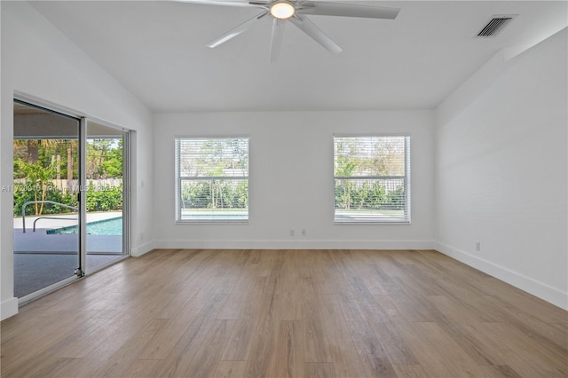 unfurnished room with light hardwood / wood-style flooring, ceiling fan, and lofted ceiling