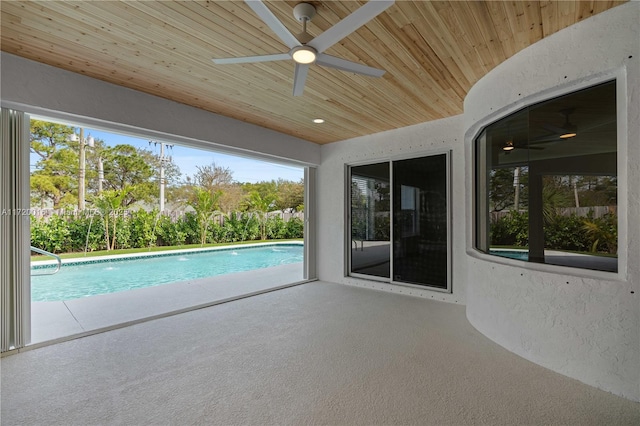 view of swimming pool with a patio area and ceiling fan