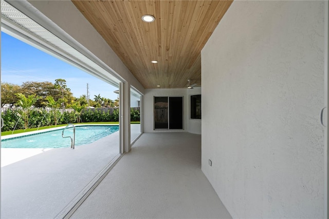 view of swimming pool with a patio area