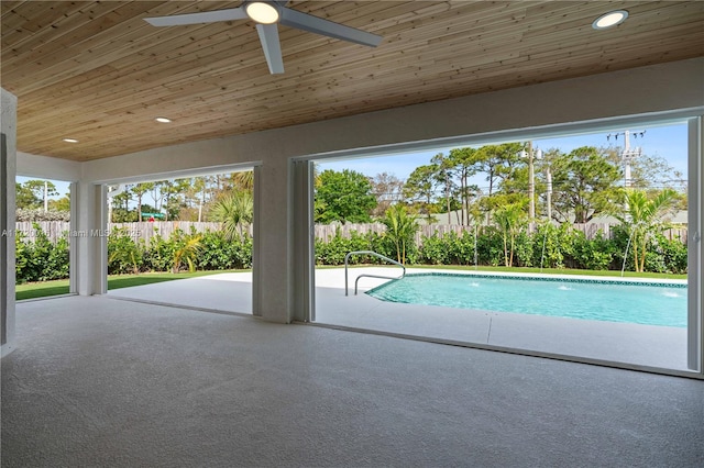 view of pool with ceiling fan and a patio area