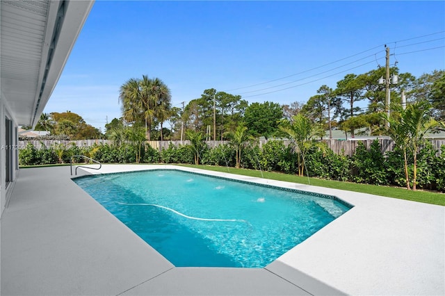 view of pool featuring pool water feature and a patio area