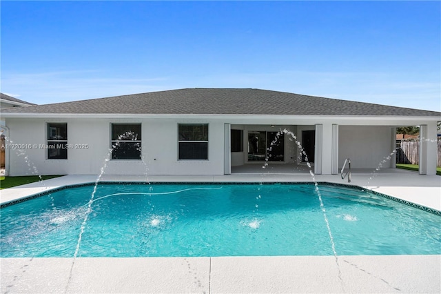 view of pool featuring pool water feature and a patio area