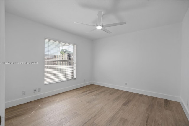 spare room with light wood-type flooring and ceiling fan