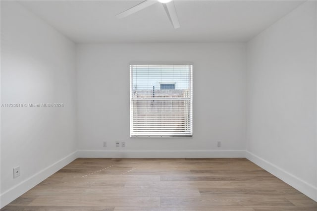 empty room with ceiling fan and light wood-type flooring