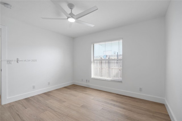 spare room with ceiling fan and light wood-type flooring