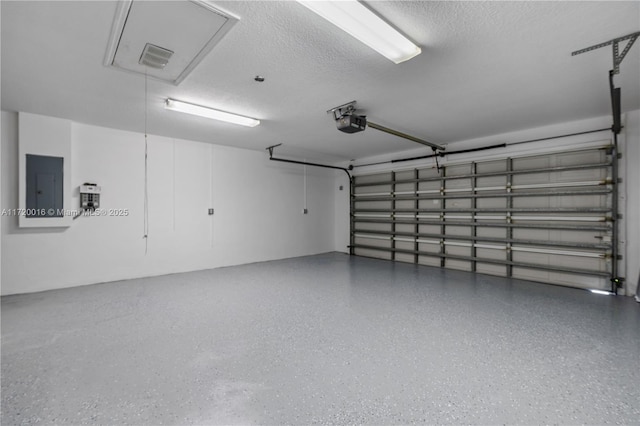 garage featuring a garage door opener and electric panel