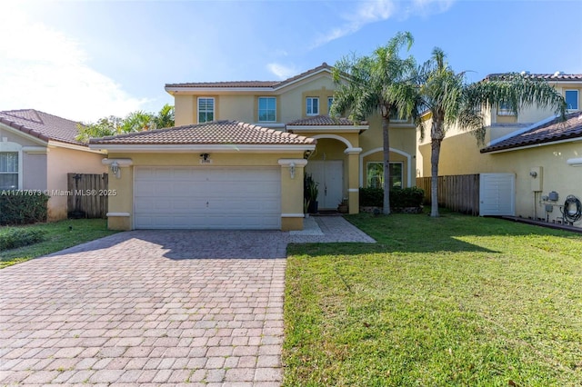 mediterranean / spanish-style home with a front yard and a garage