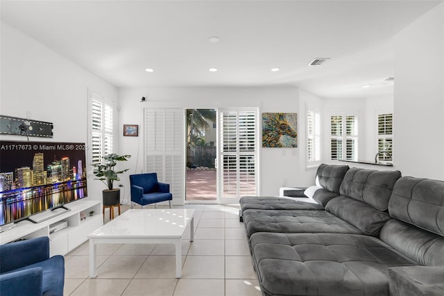 tiled living room featuring a wealth of natural light