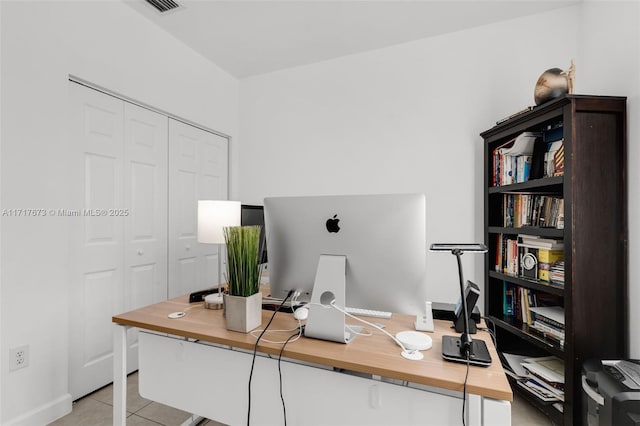 home office with light tile patterned flooring